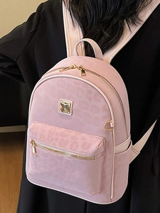 Pink leopard print backpack for women with spacious main compartment and gold hardware