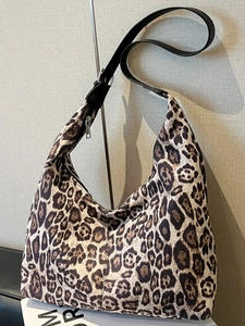 Large leopard print hobo bag with black leather shoulder strap for commute