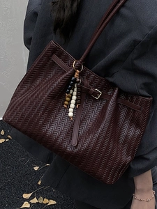 Dark brown woven tote bag for women featuring colorful beaded charm and vintage buckle