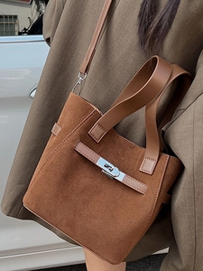 Chic brown suede bucket bag with leather handle and silver rotating lock for women