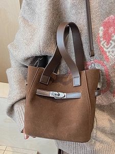 Vintage dark brown faux suede bucket bag with silver metal twist lock and shoulder strap