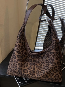 Chic leopard print hobo tote bag with adjustable brown leather straps for autumn style
