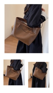 Detailed close-up showing the brown woven texture and leather craftsmanship of the tote bag