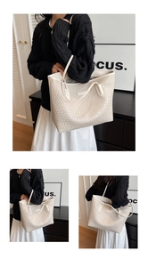 Detail view of woven leather texture on cream white large tote bag for commuting