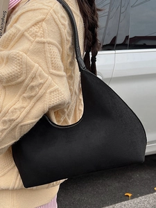 Minimalist black suede crescent shoulder bag for autumn vintage style and daily commute