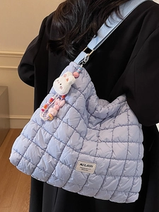 Quilted light blue cloud tote bag with rabbit charm and dopamine style shoulder strap