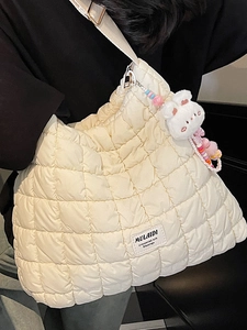 Chic cream quilted cloud shoulder bag with plush bunny charm and large capacity