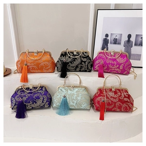 Detailed view of six vintage Chinese style embroidery evening bags with tassels