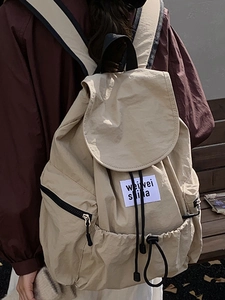 Sac à dos tendance 2025 en nylon beige avec cordon de serrage et grande capacité de loisirs