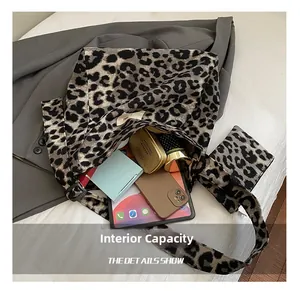 Detail of leopard print canvas tote bag interior showing large capacity for essentials