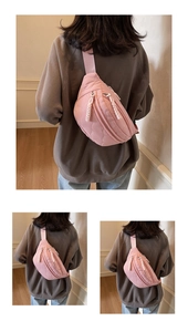 Detail der rosa gesteppten Puffer-Tasche mit Doppelreißverschluss und Web-Kordelzügen
