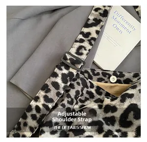 Detailed close-up of leopard canvas tote with adjustable strap and magnetic clasp