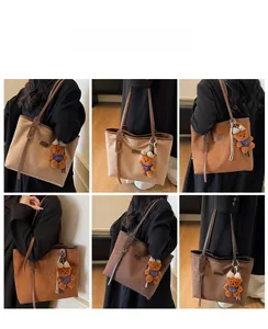 Three vintage suede tote bags in beige, caramel, and dark coffee with cute plush charms