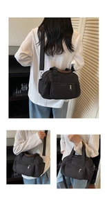 Detailed view of the multi-pocket nylon shoulder bag with adjustable strap and side pockets