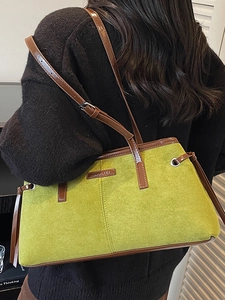 Retro moss green suede tote bag with brown leather straps and vintage metallic accents