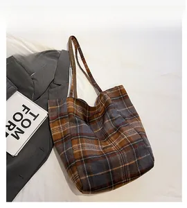 Close-up of retro plaid pattern fabric on a large capacity tote bag with long handles