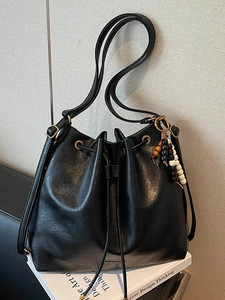 Vintage black PU leather bucket bag with drawstring closure and colorful wooden bead charms