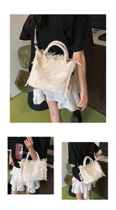Detail of off-white canvas tote with fringe edges and detachable crossbody strap