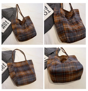 Detail showing vintage plaid pattern and large capacity design of the tote bag