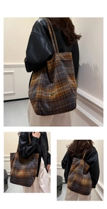 Macro detail of plaid tote bag featuring a vintage pattern and oval metal logo plaque
