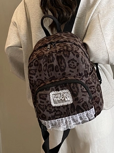 Mini leopard print backpack for women with white lace trim and double shoulder straps
