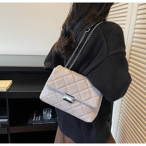 Quilted chain shoulder bag in beige grey featuring metallic lock and diamond stitching