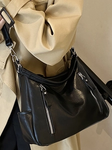 Chic black faux leather hobo shoulder bag with silver zippers and metal clips for women