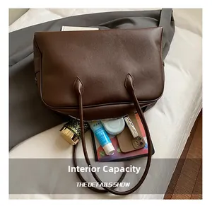 Internal view of the brown leather tote bag showcasing its spacious storage capacity