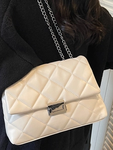 Elegant white quilted crossbody bag with silver metal lock and chain strap for women
