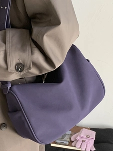 Deep purple faux suede half-moon shoulder bag for women in a stylish autumn outfit