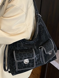 Retro black leopard print tote bag with double front pockets and white contrast stitching