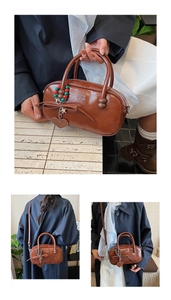 Detailed views of brown Boston bag with bow accents and star charms for women
