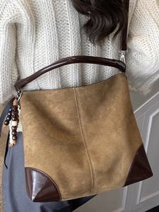 Vintage khaki suede hobo bag with dark leather trim and retro wooden bead charm