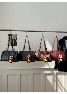 Detailed display of four vintage tote bags in black, coffee, tan and burgundy colors