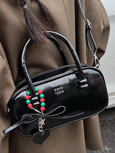 Glossy black pillow bag with colorful beaded charm for women stylish crossbody style