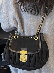 Retro black matelassé shoulder bag with gold metal buckle and leather chain strap