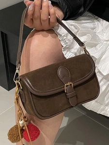 Vintage dark brown suede shoulder bag for women with leather trim and decorative charm