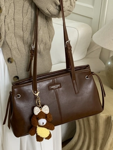 Retro brown leather shoulder bag with cute bear charm and minimalist fall style design