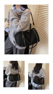 Close-up of a black tote bag showing durable fabric texture and adjustable shoulder strap
