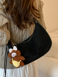 Chic black matte hobo bag for women with a cute plush bear pendant accessory