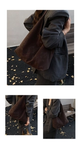 Détail du cabas en daim marron foncé avec logo embossé minimaliste et texture mate élégante