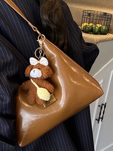 French vintage brown triangular shoulder bag in glossy leather with a cute bear charm