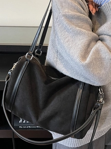 Minimalist black large capacity shoulder bag in matte suede and leather for women