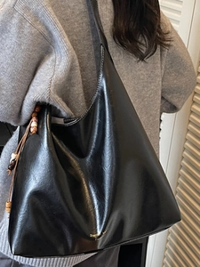Large black leather hobo bag for women with colorful wood bead charms and shoulder strap