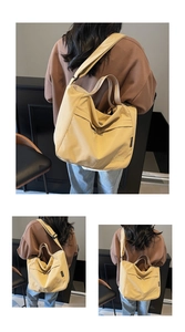 Detail view of beige canvas tote bag showing zipper closure and cute dog embroidery design