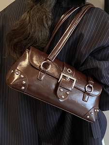 Chic dark brown vintage underarm bag with silver rivets and glossy leather finish