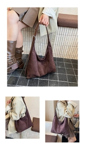 Detailed view of dark brown suede hobo bag with adjustable strap and minimalist design