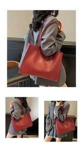 Detailed view of deep red tote bag with high-quality smooth leather texture