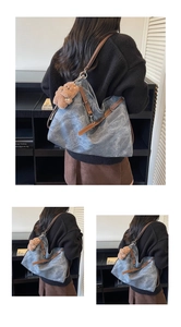 Detail of vintage denim tote bag with brown faux leather straps and cute bear charm pendant