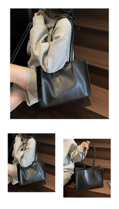 Detailed view of a large black leather tote bag with long handles for stylish commuting